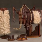 William Heisman, miniature set including saddle, bridle, cuffs, chaps, and spurs, mixed media. Estimate: $12,000-$15,000.