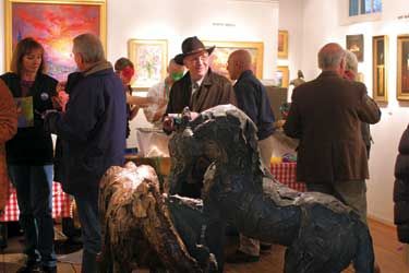Siri Hollander sculptures and a crowd of art enthusiasts at Canyon Road Fine Art
