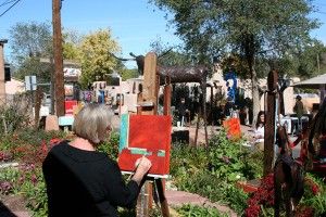 Artists paint and attendees peruse the galleries along Canyon Road during last year’s paint-out.