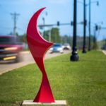 Red Sails, a red powder coated steel piece by Jim Stewart, on Kelly north of Covell in median